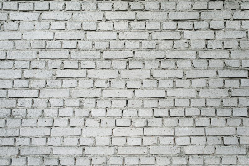 Masonry type retaining wall
